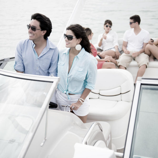 A group of people on a boat in the water.