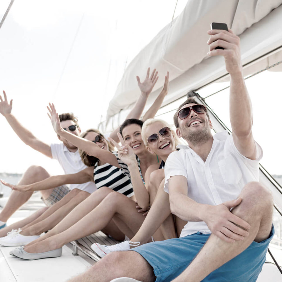 A group of people sitting on top of a boat.